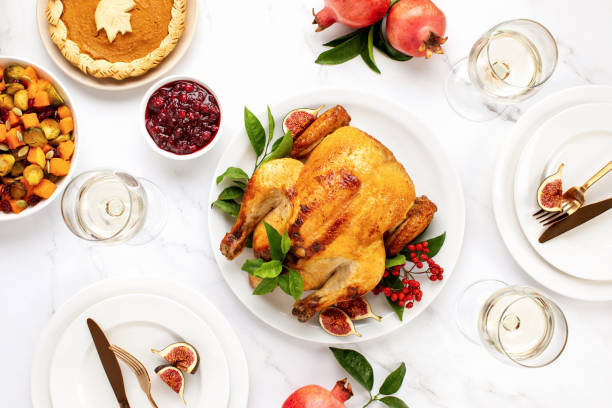 istock Turkey or chicken served with light white wine for festive dinner, top down view 1272959077