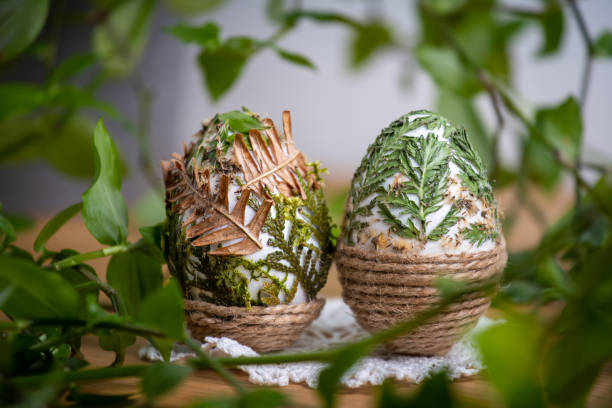 istock Forest themed Easter eggs decorated with natural leafs - holiday table decoration during celebration 1272960314
