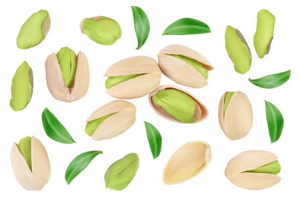 istock pistachio isolated on white background . Top view. Flat lay 1272960955