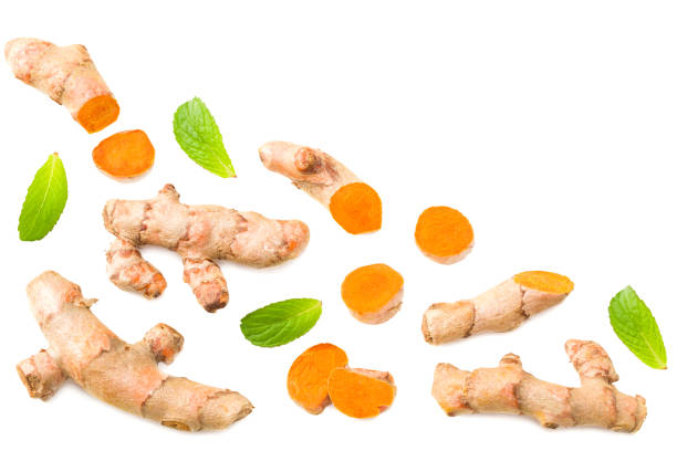 istock Turmeric root with turmeric slices isolated on white background. Top view. 1272961173