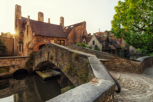 The old and picturesque bridge that connects the backyard of the Church of our Lady with the park of the Arentshuis.