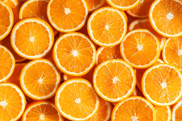 istock Oranges and citruses isolated on yellow background 1272963957