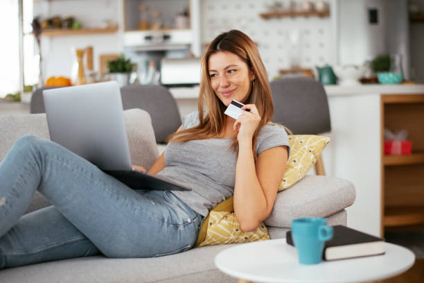 istock Young businesswoman at home makes a purchase on the Internet. 1272964174