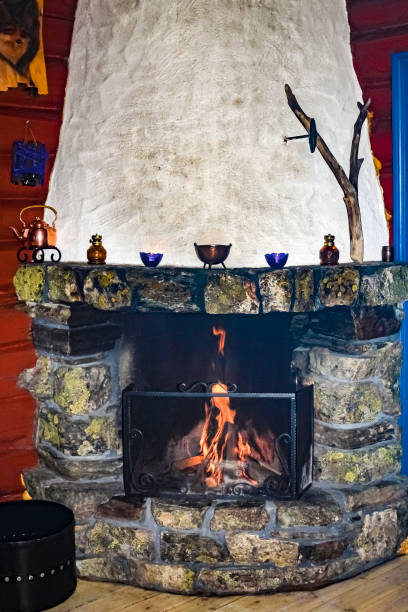 istock Old stone and wood fireplace in a Norwegian cabin, Hemsedal. 1272965068