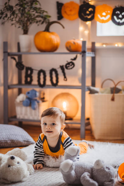 istock Baby in costume crawling on Halloween 1272966386