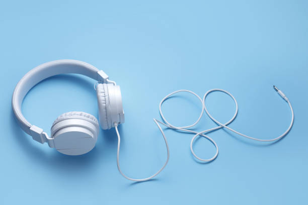 istock White headphone on blue background. Music concept. 1272967259