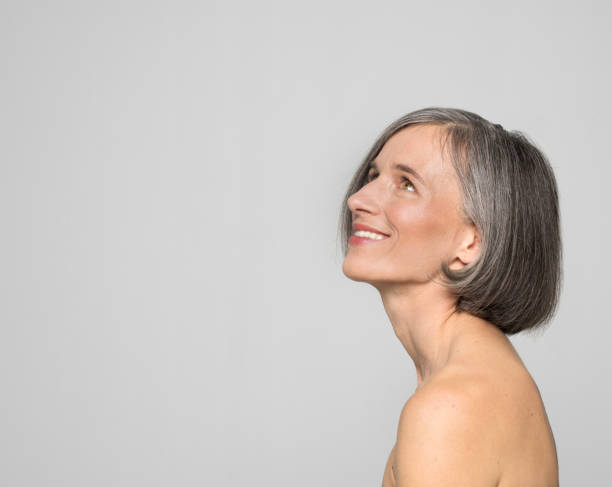 istock Side view of smiling mature woman 1272968328