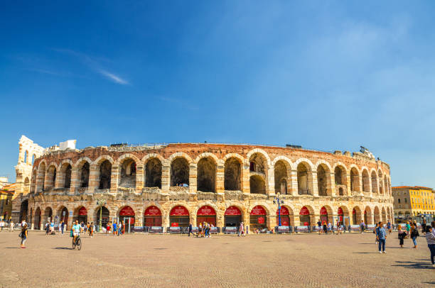Verona Arena in Piazza Bra square Verona, Italy, September 12, 2019: Verona Arena in Piazza Bra square. Roman amphitheatre Arena di Verona ancient building, sunny day, blue sky background, copy space, Verona city historical centre verona opera stock pictures, royalty-free photos & images
