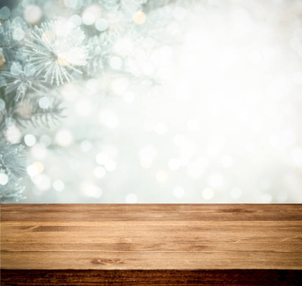 istock Christmas tree branches with wooden background 1272968536