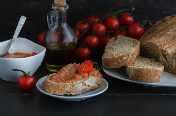 istock Popular Spanish breakfast. Crusty bread with fresh cherry tomato and olive oil is typical tapa  in Spain, especially in Catalonia 1272968801
