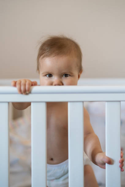 istock Baby in the crib 1272971816