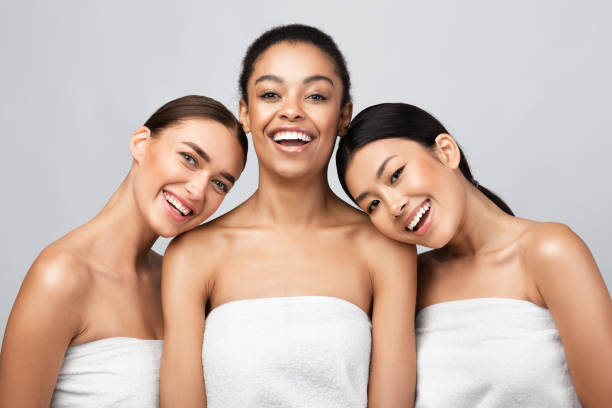 istock Three Positive Pretty Girls Posing After Shower In Studio 1272972108