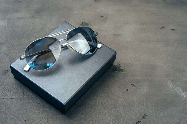 istock New dark aviator glasses on grey concrete background 1272972698