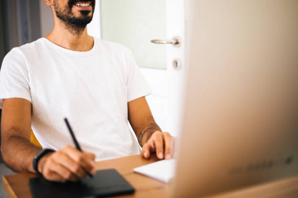 istock Artist Photographer Retouching Photo On Computer With Graphic Tab 1272972997