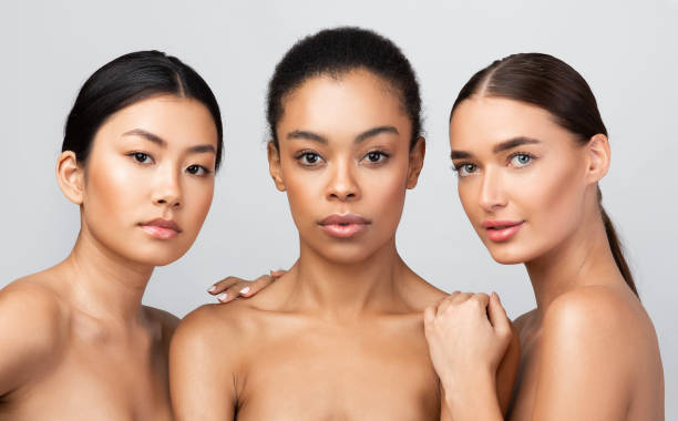 istock Three Sensual Multicultural Girls Posing Shirtless Standing Together, Studio Shot 1272973027