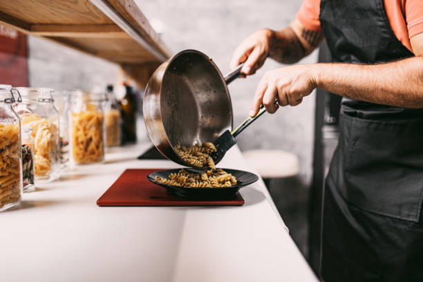istock Spaghetti fast food worker 1272973332