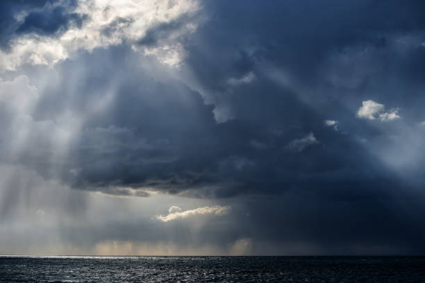 istock Autumn storm over the Black sea with rain and sun rays 1272976458