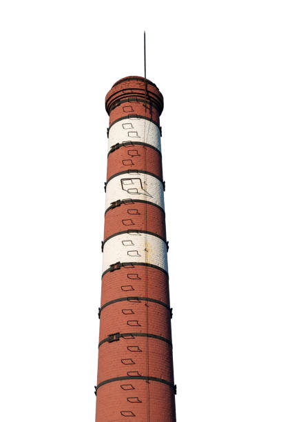 istock Old red-white brick chimney with lightning rod and ladder, isolated on white 1272976461