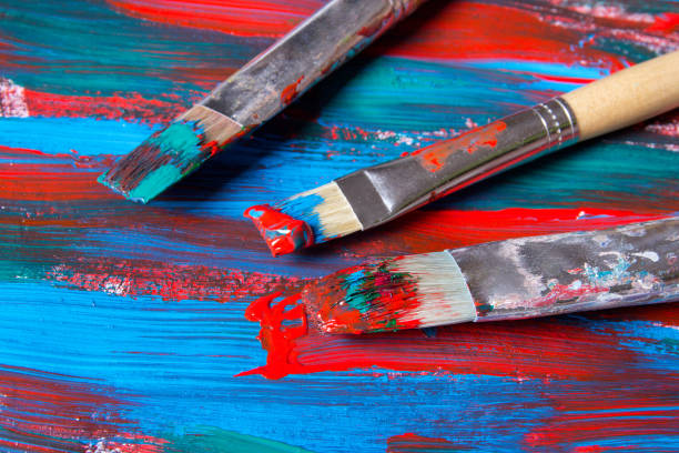 istock brushes on acrylic paint background with blue and red strokes 1272976958