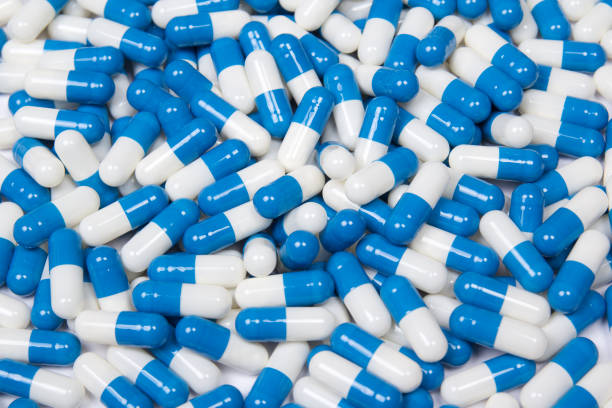 istock background of blue and white pills 1272976978