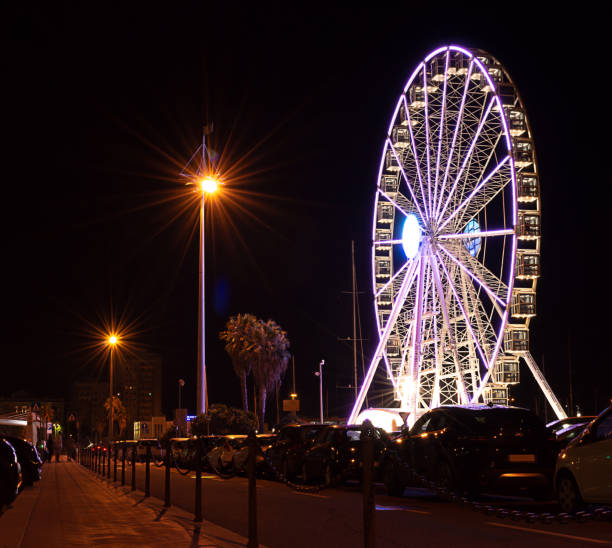 istock view from the road - ferris wheel at night 1272977828