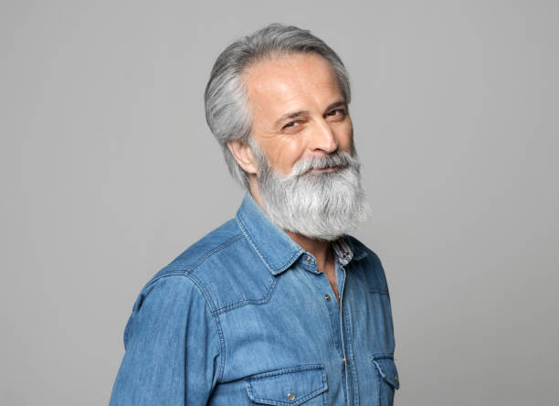istock Portrait of smiling mature man 1272978089