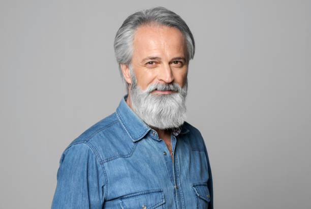 istock Portrait of smiling mature man 1272978166