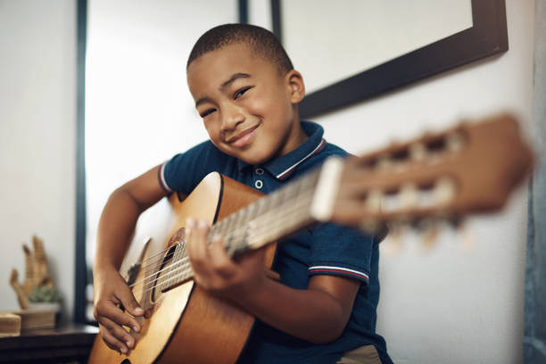 istock I'm having so much fun learning to play the guitar 1272981379