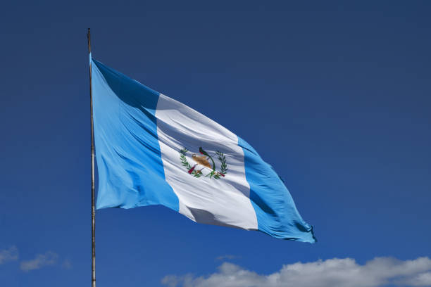 National flag of Guatemala Guatemala City, Central America: national flag of Guatemala in the wind puerto quetzal guatemala stock pictures, royalty-free photos & images
