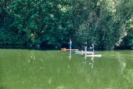 Remseck, Germany - September, 13 - 2020: Stand up paddlers on the Neckar river