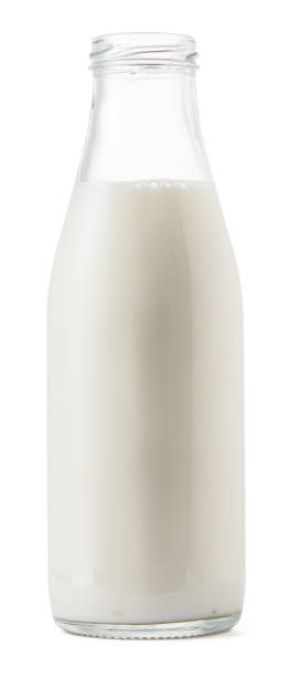 istock Open glass bottle of milk isolated on white 1272981995