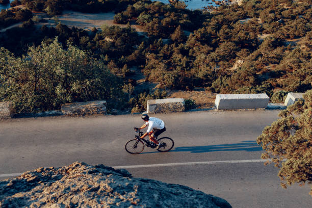 istock Cyclist riding on his bicycle at coastal road 1272983801