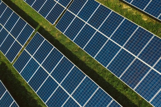 istock New solar panels on a green hill 1272983843
