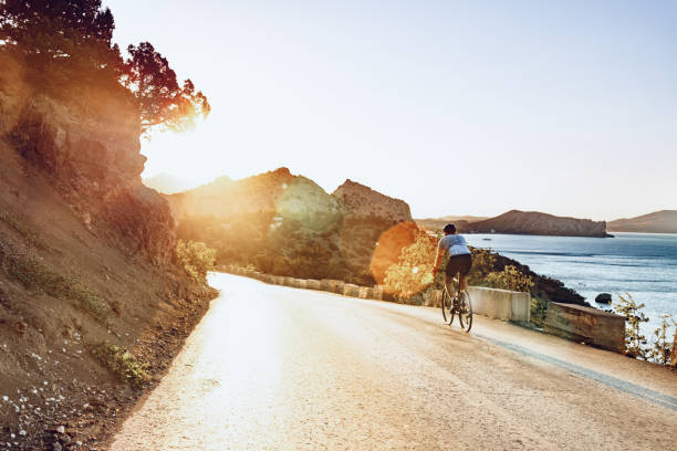 istock Cyclist riding on his bicycle at coastal road 1272983882