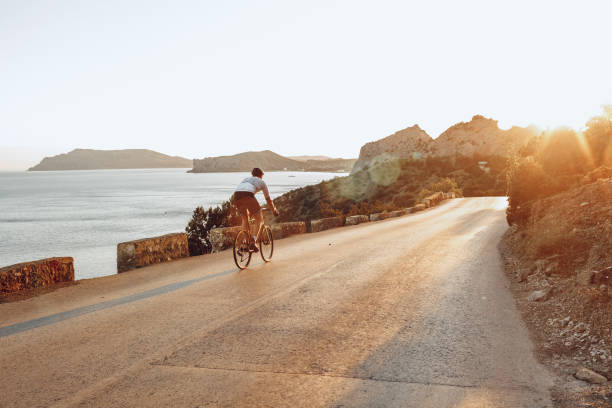 istock Cyclist riding on his bicycle at coastal road 1272983964