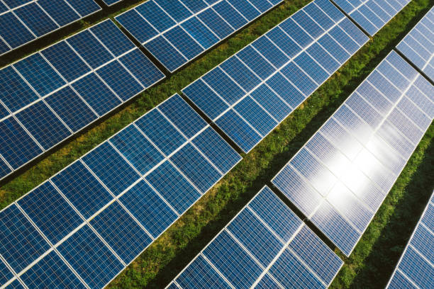 istock New solar panels on a green hill 1272984682