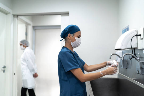 istock Nurse washing hands at hospital 1272984979