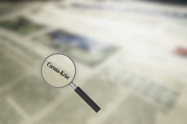istock A newspaper, magnifying glass and articles about the Corona crisis 1272986944