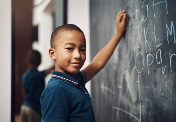 i wrote the alphabet all by myself - education blackboard africa youth culture imagens e fotografias de stock