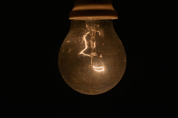 istock Incandescent lamp bulb in the dark 1272987869
