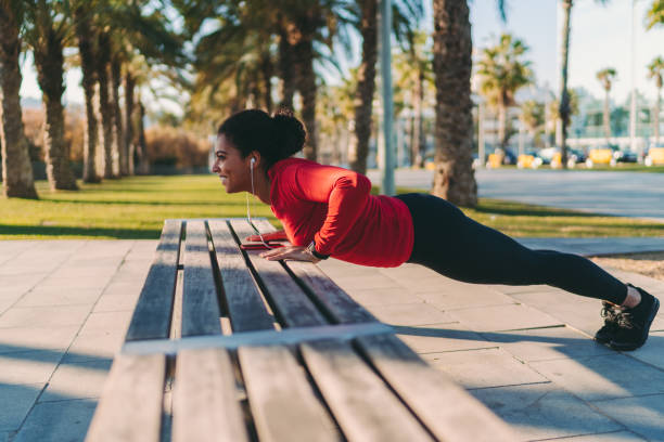 istock Sportswoman doing push-ups 1272989472