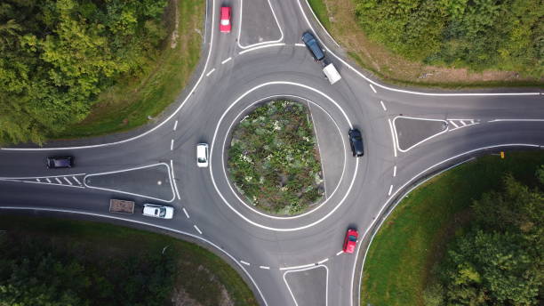 istock Roundabout with cars 1272990201