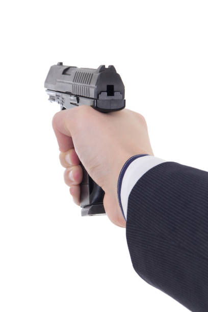 istock male hand holding gun isolated on white 1272990291
