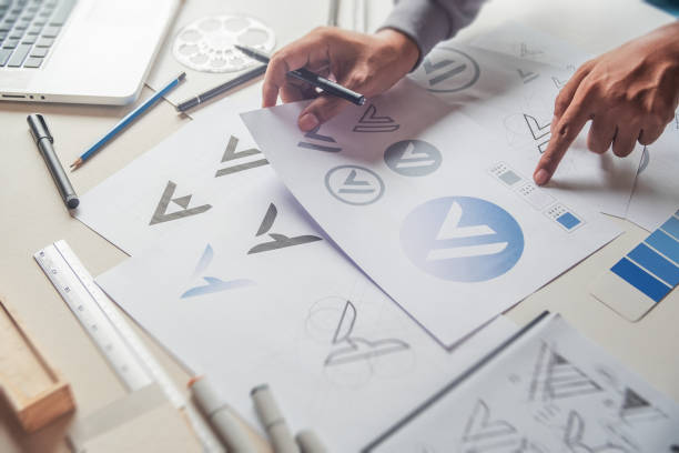 istock Graphic designer creative design sketch drawing logo Trademark brand Workspace 1272991021