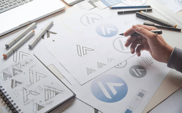 istock Graphic designer creative design sketch drawing logo Trademark brand Workspace 1272991022