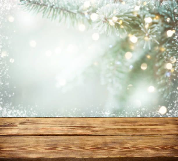 istock Christmas tree branches with wooden background 1272992298