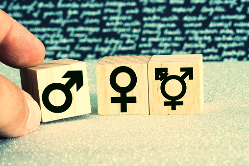 A man and gender symbols