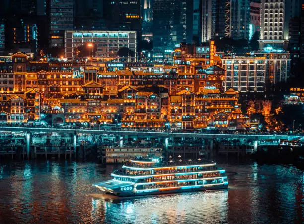 Tourist boat and Nightscape of Hongyadong Ancient Town in Chongqing, China
