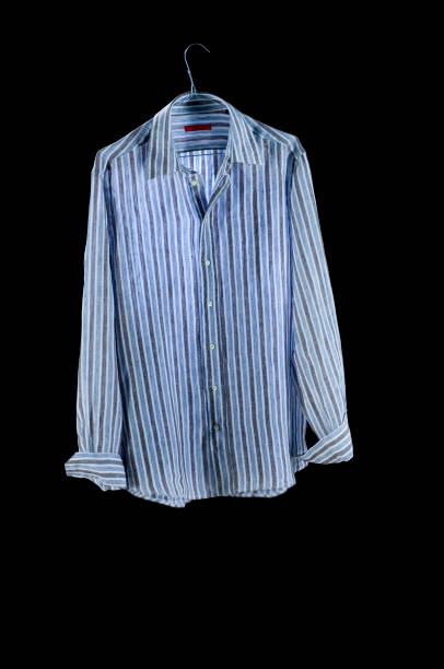 istock Clothes: Blouse striped on hanger, on a black background. 1272994794