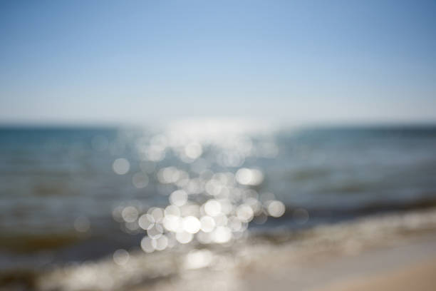 istock abstract blurred background with a view of the sea and a bright sun 1272995437